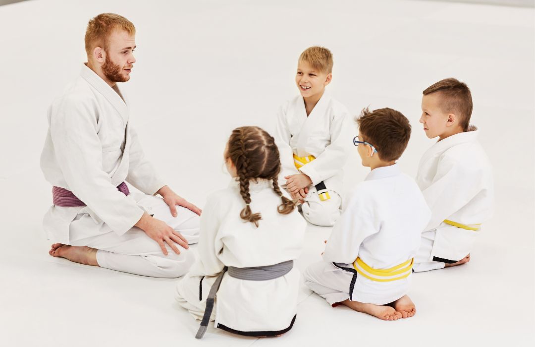 Martial arts children demonstrating active listening